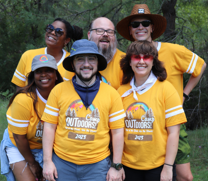 Camp Outdoors parents and trusted adults posing in matching yellow t-shirts