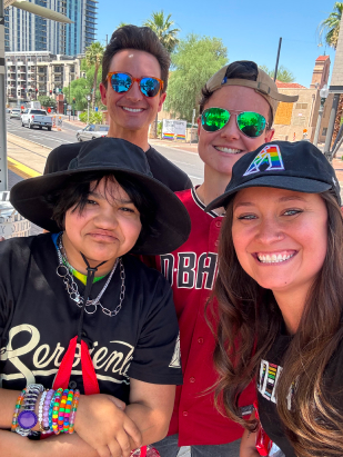 group of people in Diamond Backs jerseys posing together in Downtown Phoenix