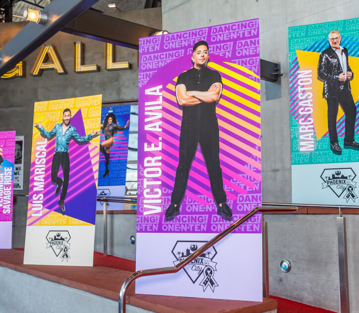 Large and colorful banner stands line the walkway at Tempe Center for the Arts preceding a one•n•ten event