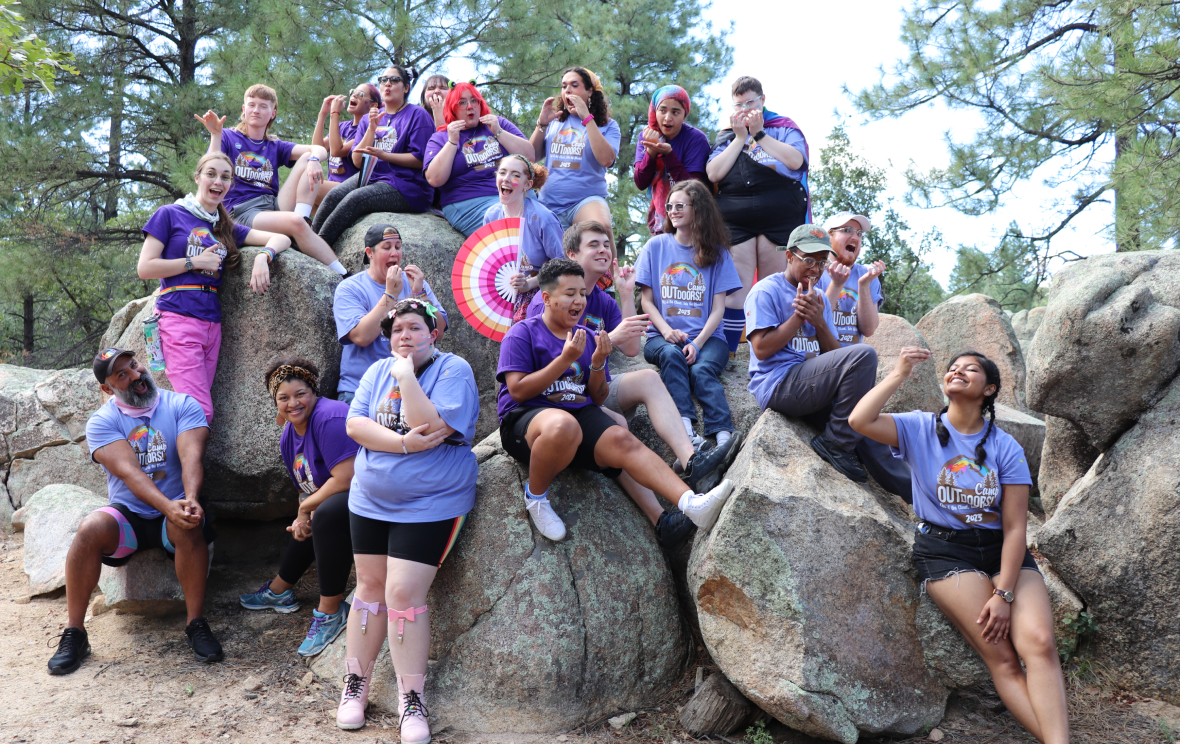 Camp Outdoors youth posing on large granite boulders