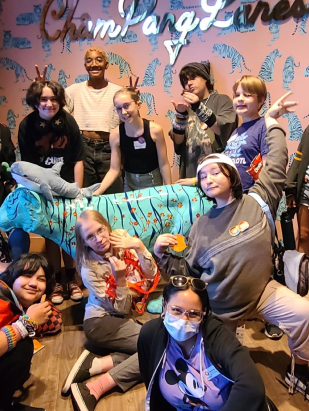 Group of LGBTQ youth posing at the bowling alley