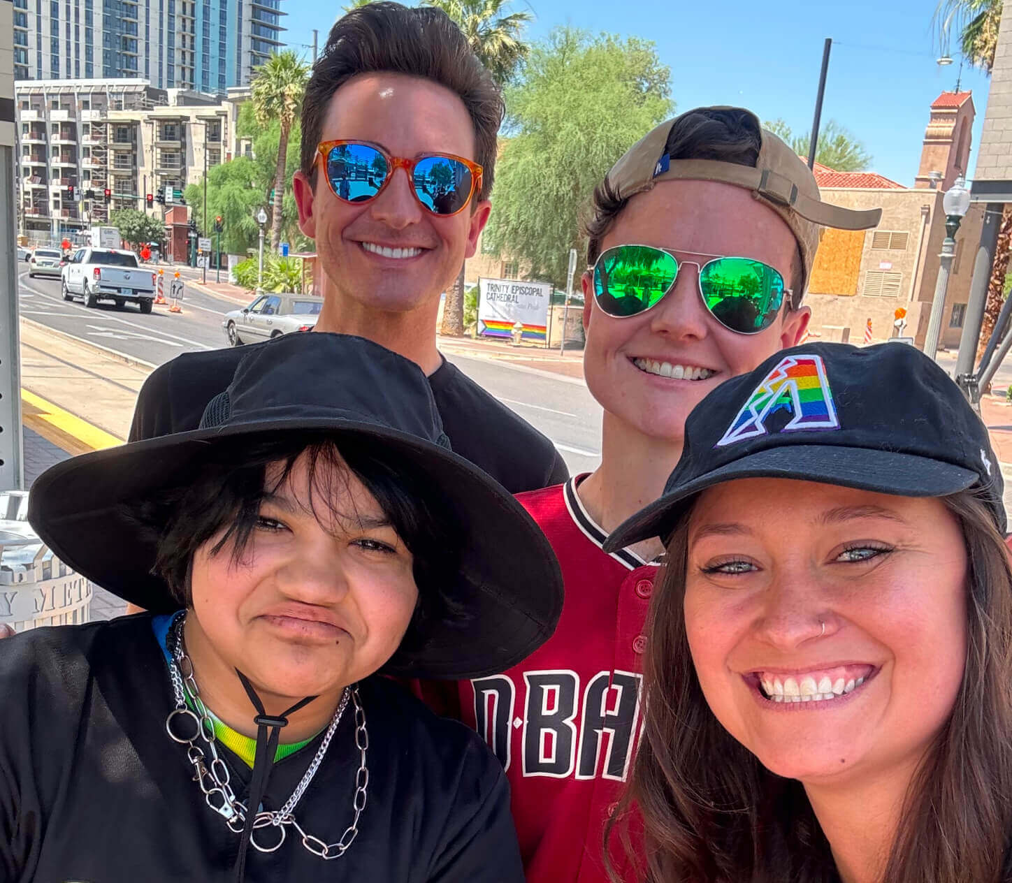 group of people in Diamond Backs jerseys posing together in Downtown Phoenix