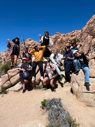 Group of LGBTQ youth posing on the rocks at Papago Park