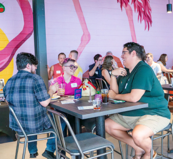 Happy people sitting and eating together