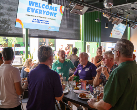 Group of people mingling at a fundraiser event